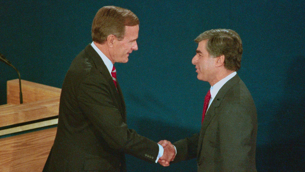George H. W. Bush shakes hands