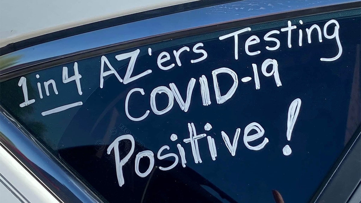 A slogan is seen on a car in "a motor march” protest of teachers who took it to their vehicles to demand a delay in in-person learning in the fall, due to the coronavirus disease (COVID-19) outbreak, in Phoenix, Arizona, U.S., July 15, 2020. Picture taken July 15, 2020. REUTERS/Kelley Fisher NO RESALES. NO ARCHIVES - RC2NVH9P22JL