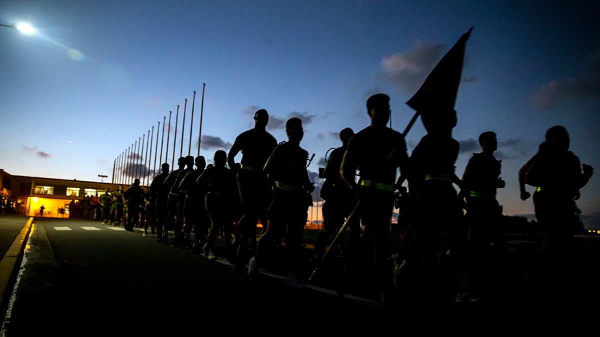 U.S. Marines assigned to Headquarters and Support Battalion, Marine Corps Base Camp Butler, participate in a battalion run at Camp Foster, in Okinawa, Japan, in 2018. (U.S. Marine Corps photo by Sgt. Timothy Turner)