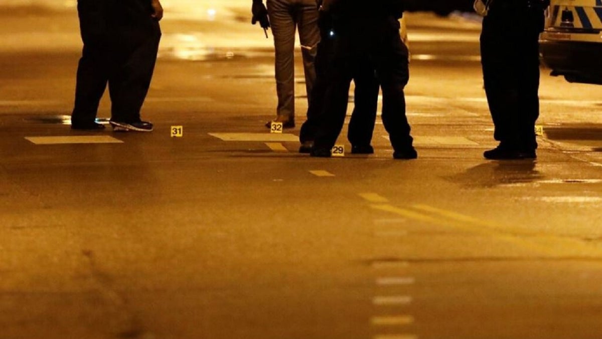 Evidence markers are seen on the ground as Chicago Police officers investigate the scene of a shooting in Chicago, Illinois, on July 21, 2020.(KAMIL KRZACZYNSKI/AFP via Getty Images)