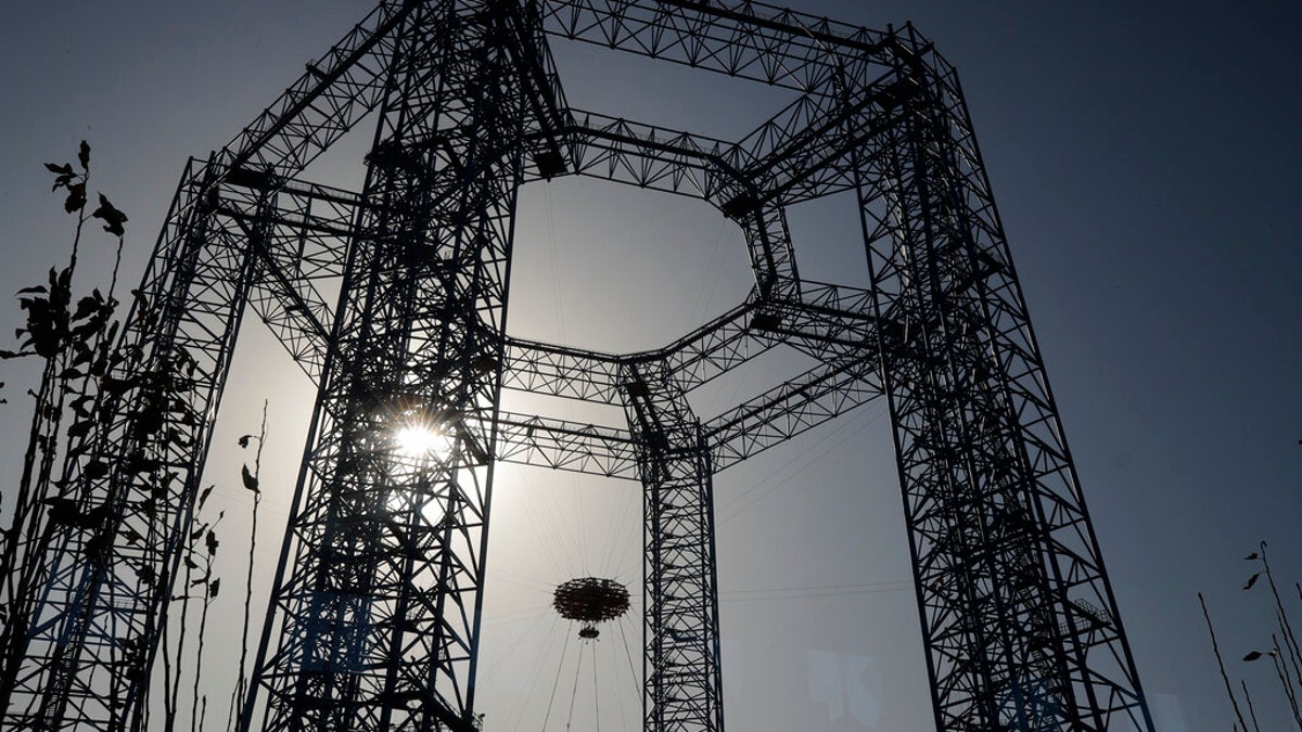 In this Thursday, Nov. 14, 2019 file photo, a Mars lander is lifted during a test for its hovering, obstacle avoidance and deceleration capabilities at a facility at Huailai in China's Hebei province.