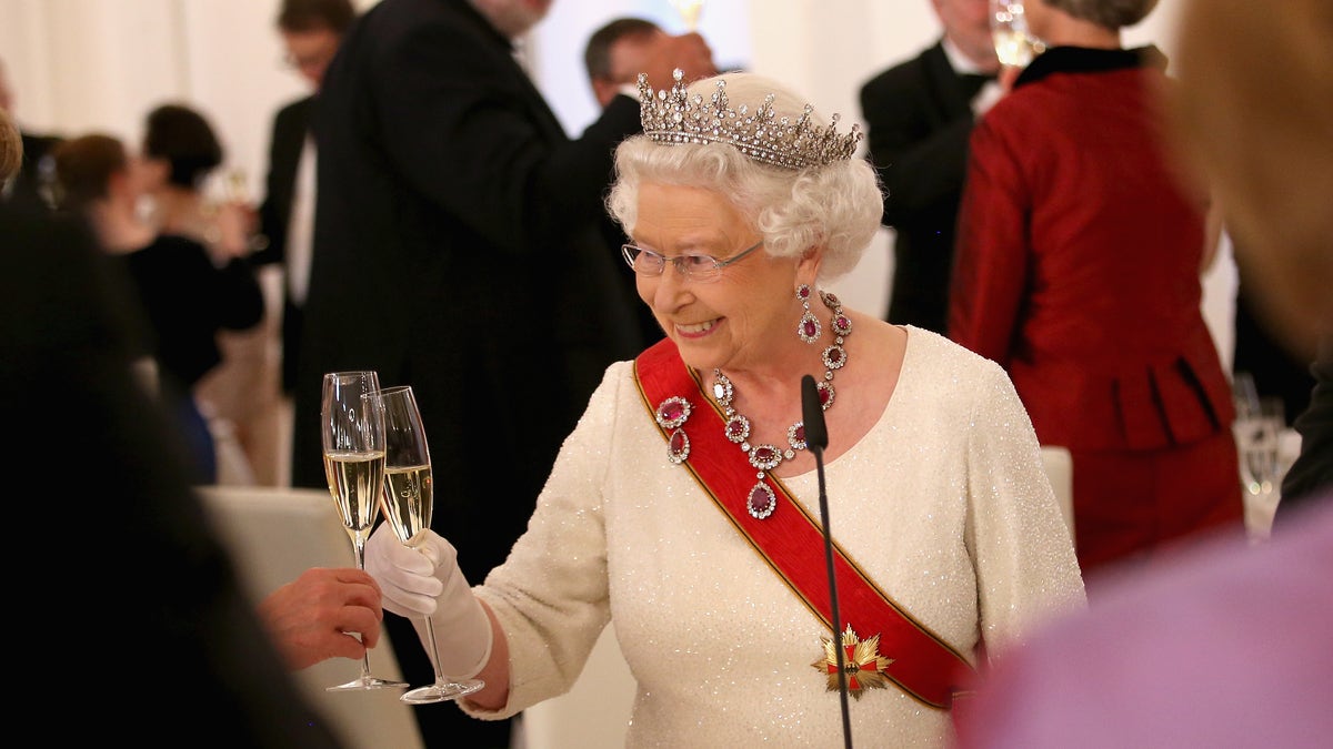 Queen Elizabeth II toasts guests after giving a speech during a State Banquet at the Schloss Bellevue Palace on the second day of a four day State Visit on June 24, 2015 in Berlin, Germany.