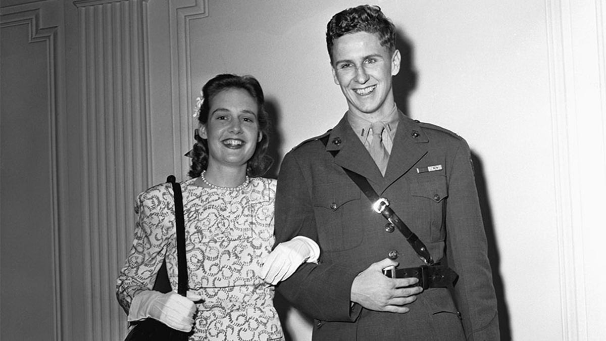Lieutenant Cord Meyer, Jr., USMC, aide to Commander Harold Stassen, with his bride, the former Mary Pinchot, daughter of the late Amos Pinchot and niece of the former Governor of Pennsylvania, Gifford Pinchot, after their marriage at the home of the bride, 1165 Park Ave.