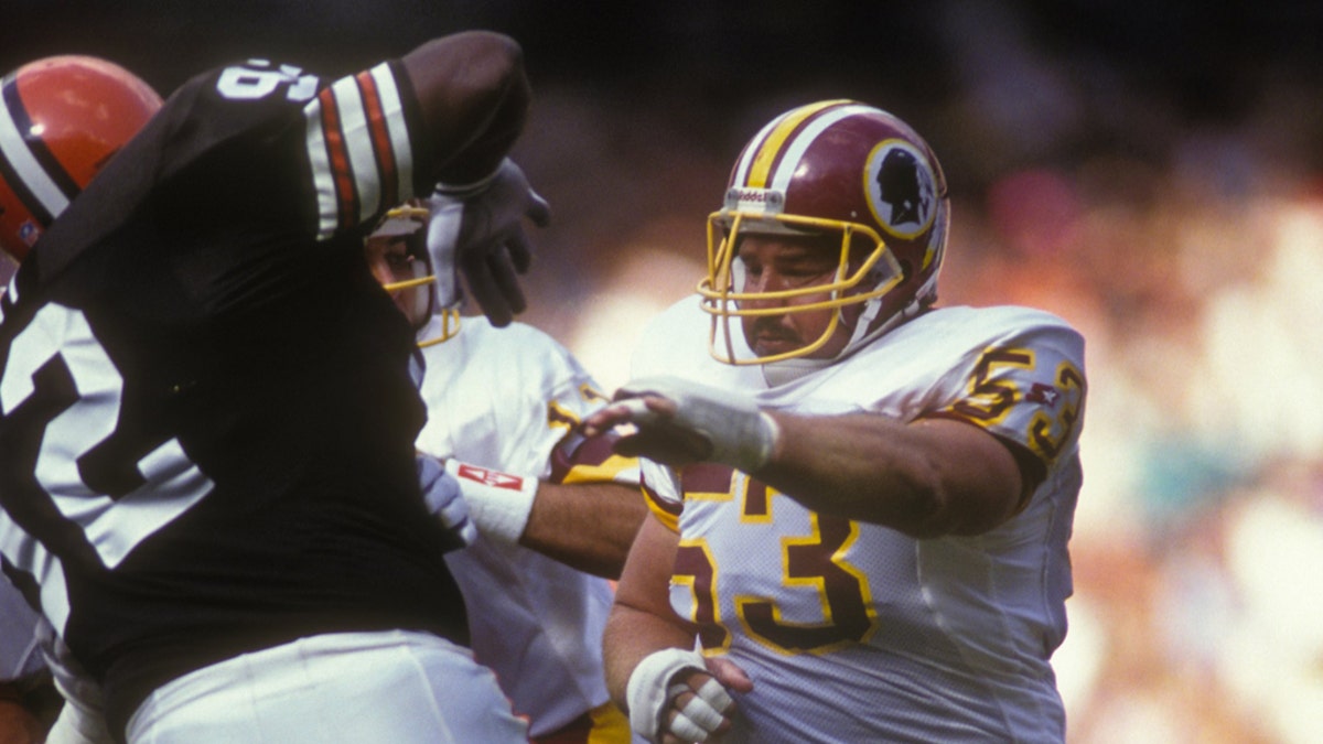 WASHINGTON - OCTOBER 13: Jeff Bostic #63 of the Washington Redskins makes a block during a NFL football game against the Cleveland Browns on October 13, 1991 at RFK Stadium in Washington DC. (Photo by Mitchell Layton/Getty Images)