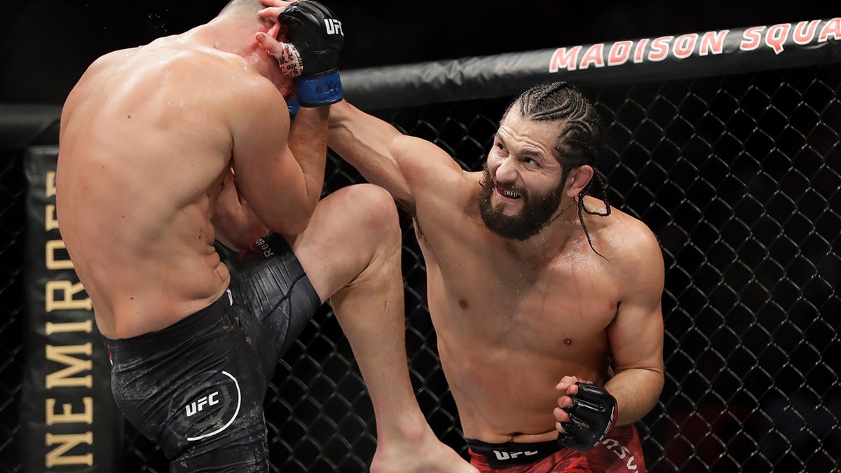 In this Nov. 3, 2019, file photo, Jorge Masvidal, right, punches Nate Diaz during the second round of a welterweight mixed martial arts bout at UFC 244 in New York.