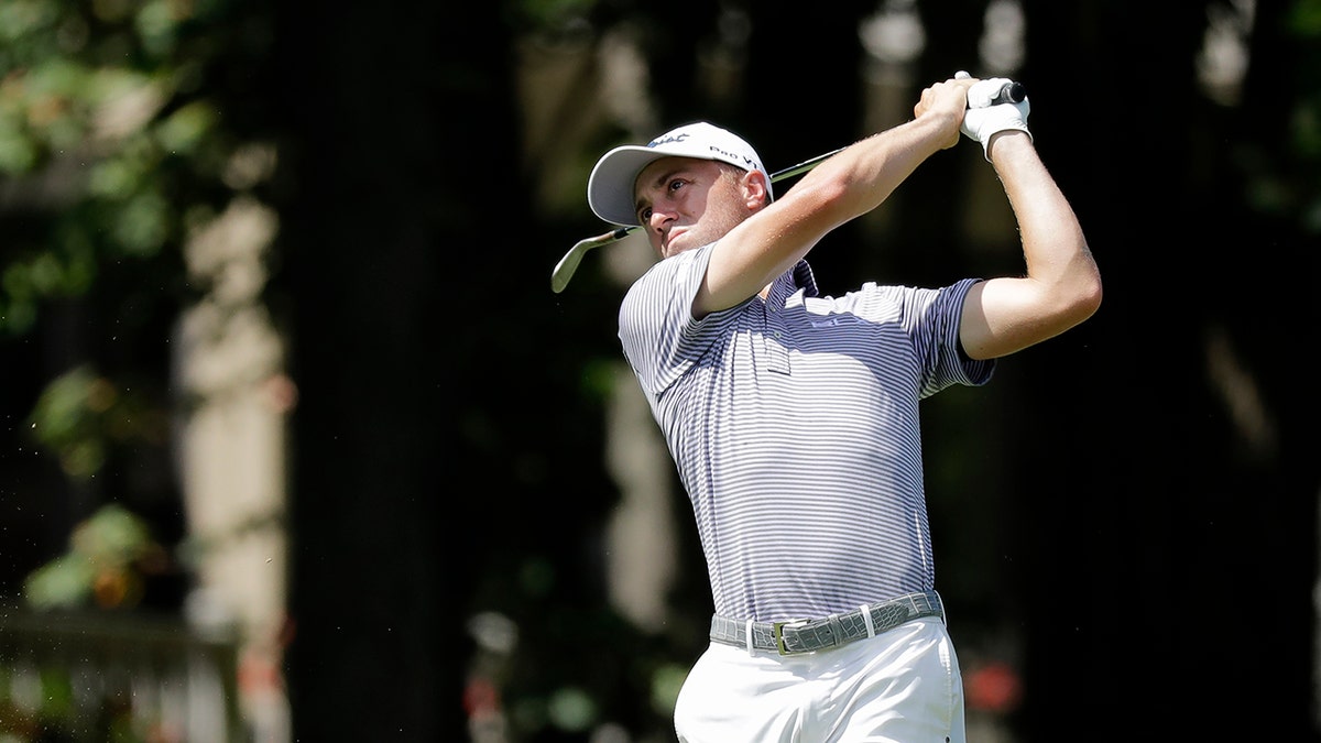 Justin Thomas hits toward the ninth green during the second round of the Memorial golf tournament, Friday, July 17, 2020, in Dublin, Ohio. (AP Photo/Darron Cummings)