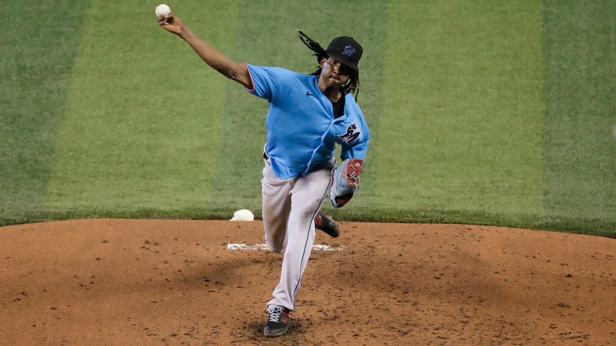 Miami Marlins' Jose Urena pitches during a baseball workout at Marlins Park, Thursday, July 16, 2020, in Miami. (AP Photo/Wilfredo Lee)