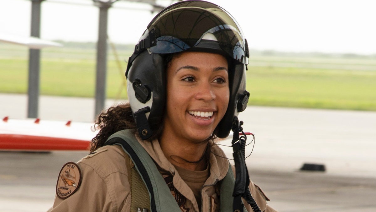 Student Naval Aviator Lt. j.g. Madeline Swegle, assigned to the Redhawks of Training Squadron (VT) 21 at Naval Air Station Kingsville, Texas, exits a T-45C Goshawk training aircraft following her final flight to complete the undergraduate Tactical Air (Strike) pilot training syllabus, July 7, 2020. Swegle is the U.S. Navy's first known Black female strike aviator and will receive her Wings of Gold during a ceremony July 31. (U.S. Navy photo by Anne Owens/Released)