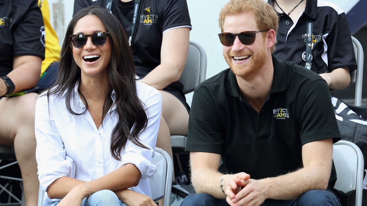 Meghan Markle (left) and Prince Harry at the 2017 Toronto Invictus Games. They were reportedly secretly engaged at the time, according to a new book. (Photo by Chris Jackson/Getty Images for the Invictus Games Foundation )