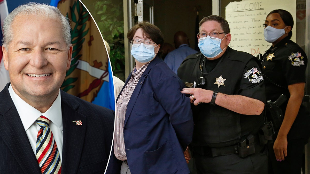 Protestors are escorted out of the office of Oklahoma County District Attorney David Prater in handcuffs at closing time, after staging a sit-in and refusing to leave, Monday, July 20, 2020, in Oklahoma City.