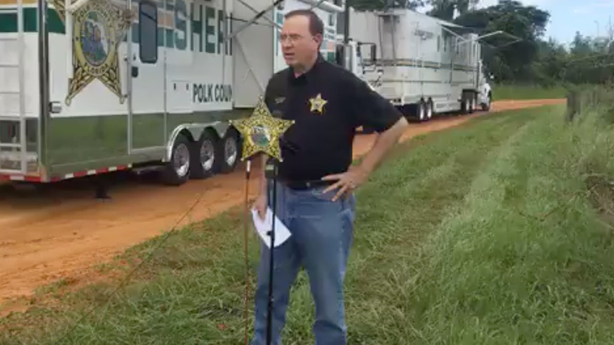 Polk Sheriff Grady Judd briefed reporters Saturday at the scene of a triple homicide on Lake Streety in Frostproof, Florida.