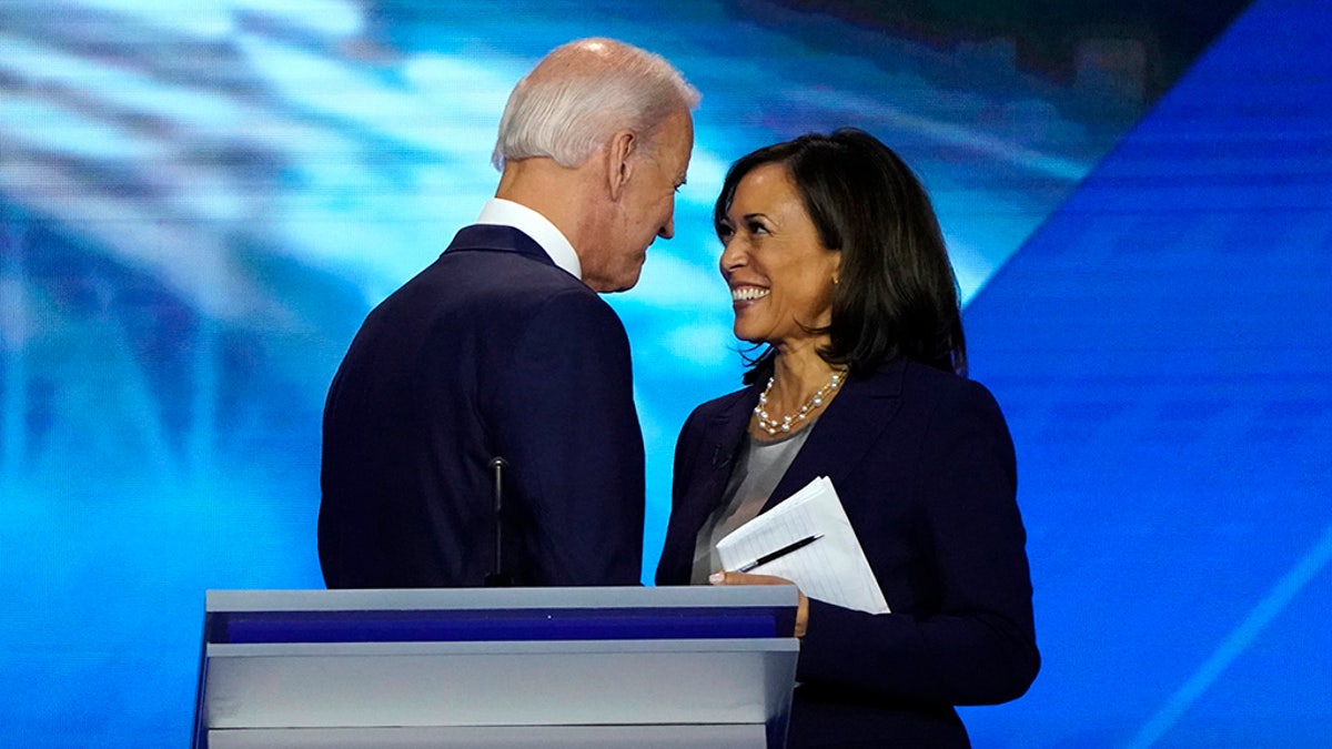 Former Vice President Joe Biden talks with Senator Kamala Harris after the conclusion of the 2020 Democratic U.S. presidential debate in Houston, Texas, U.S., September 12, 2019. REUTERS/Mike Blake - HP1EF9D08FC65