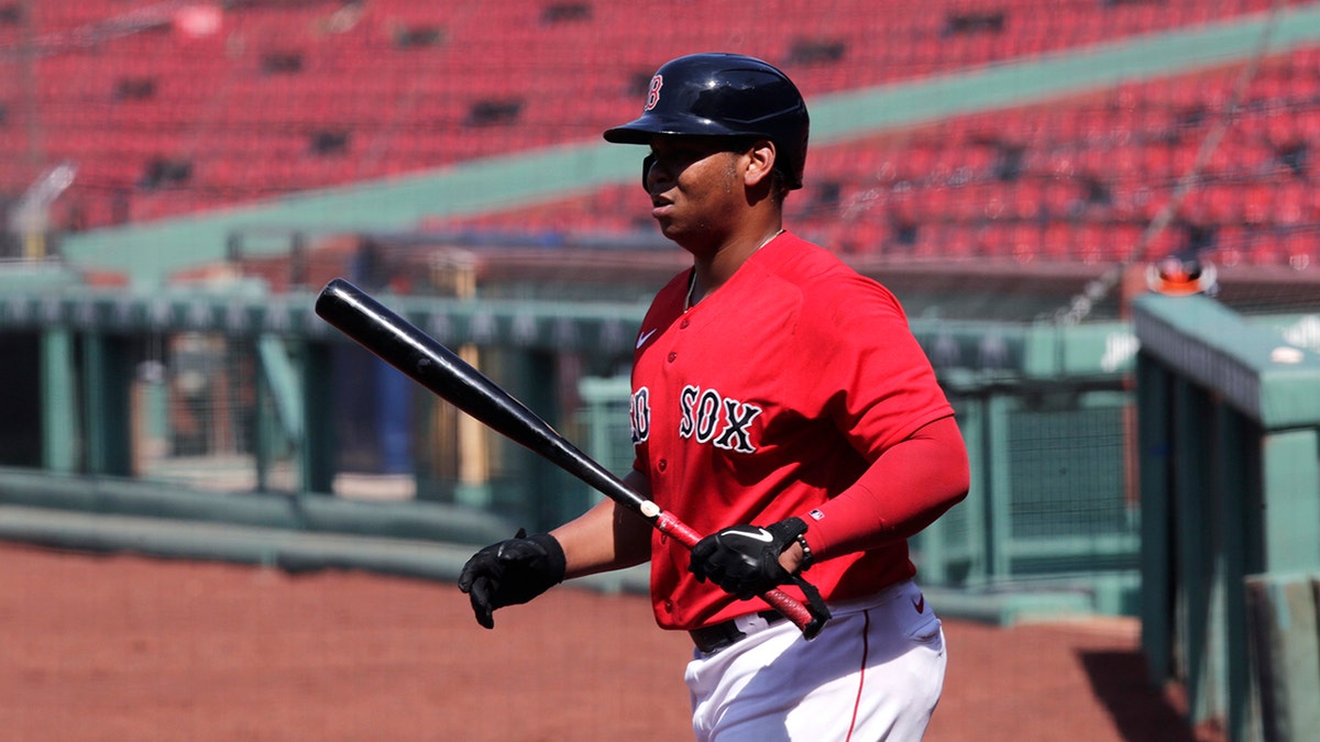 Boston Red Sox's Rafael Devers heads to the plate for an at-bat during an intra-squad game at Fenway Park on Thursday, July 9, 2020, in Boston. (AP Photo/Charles Krupa)