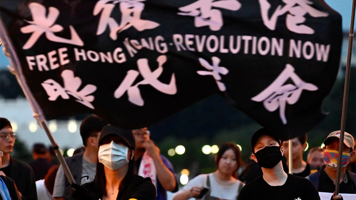 A demonstrator waves a flag during a rally to show support for Hong Kong pro-democracy protests at Free Square in Taipei on June 13, 2020. (Photo by SAM YEH/AFP via Getty Images)
