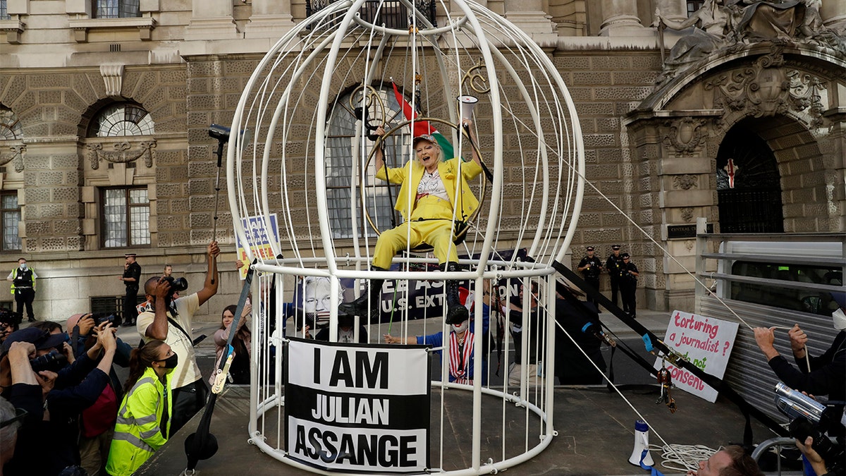 Designer Vivienne Westwood supports Julian Assange with odd