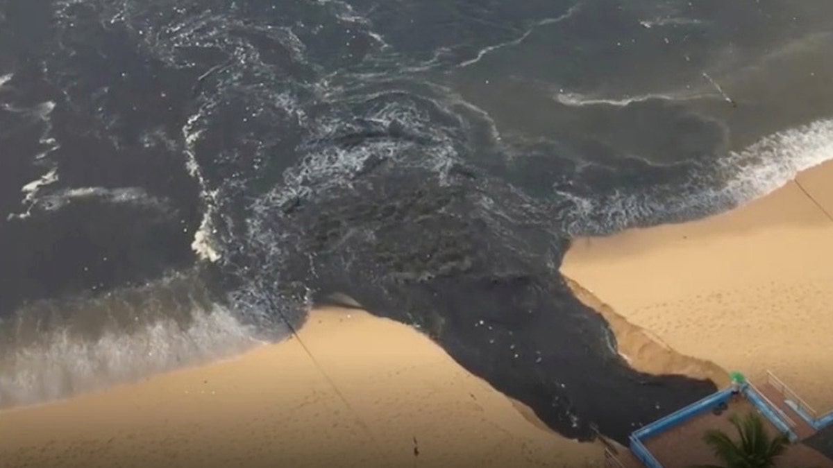 "Black water" flows into Acapulco Bay in Acapulco, Guerrero, Mexico June 25, in this picture obtained from social media. Picture taken June 25.