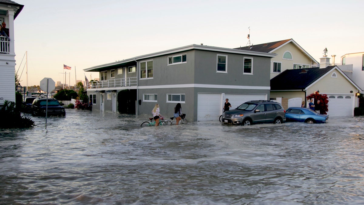 Streets in the Balboa Peninsula are flooded by coastal tides and high surf in Newport Beach, Calif., July 3.