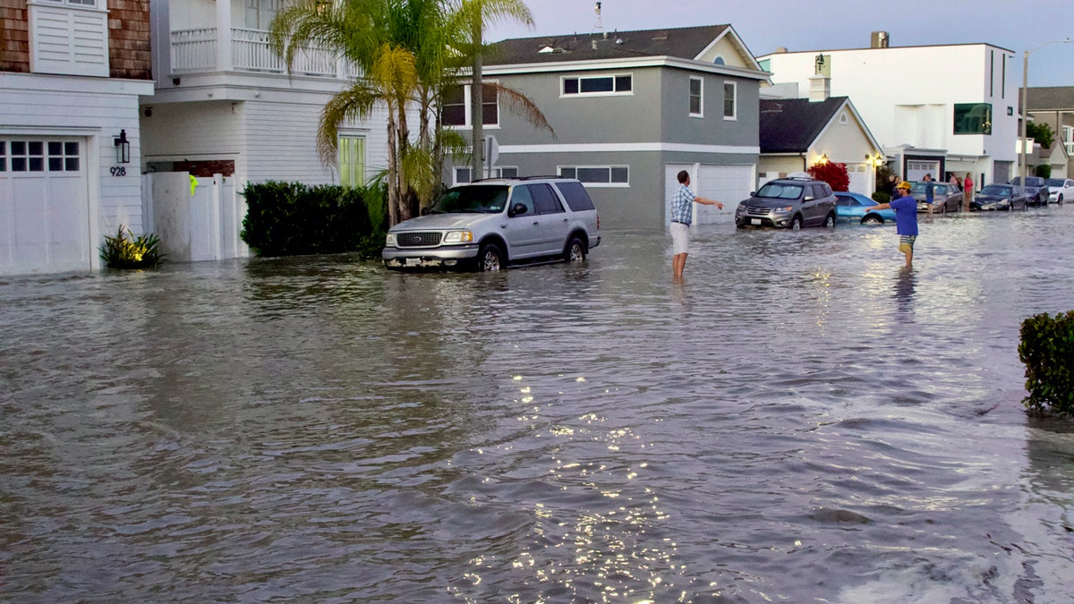 Homes and streets near the coastline are seen flooded with seawater in Newport Beach, Calif., July 3.