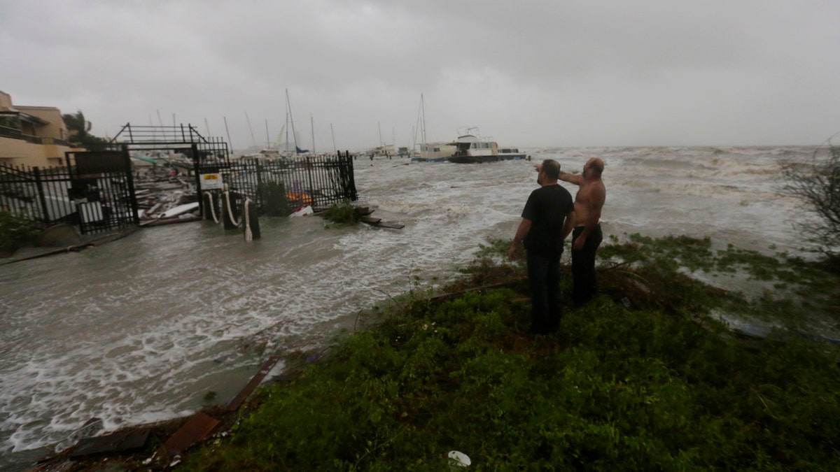 Boat owners examine the damage after the docks at the marina where their boats had been secured were destroyed as Hurricane Hanna made landfall, Saturday, July 25, 2020, in Corpus Christi, Texas.