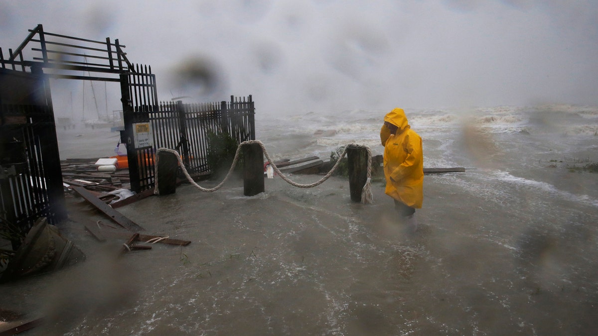 Jame Rowles examines the damage after the docks at the marina where his boat was secured were destroyed as Hurricane Hanna made landfall, Saturday, July 25, 2020, in Corpus Christi, Texas.