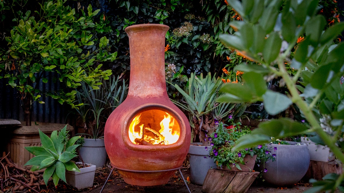 The classic chiminea, the Spanish word for chimney, burns by design like a fireplace. 