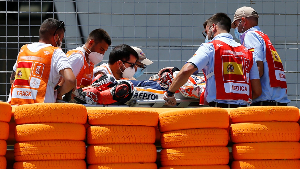 Marquez walked away from the crash, but was taken to the medical center on a stretcher.