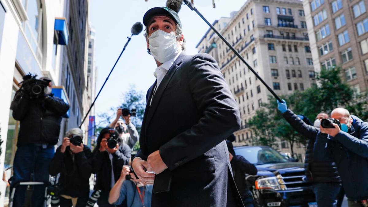 Michael Cohen arrives at his Manhattan apartment, Thursday, May 21, 2020, in New York. President Donald Trump's longtime personal lawyer and fixer was released federal prison Thursday and is expected to serve the remainder of his sentence at home.