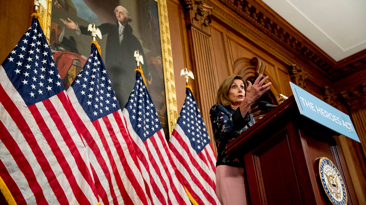 House Speaker Nancy Pelosi of Calif. speaks at a news conference on Capitol Hill in Washington, Wednesday, July 15, 2020, to mark two months since House passage of "The Heroes Act" or the Health and Economic Recovery Omnibus Emergency Solutions Act. (AP Photo/Andrew Harnik)