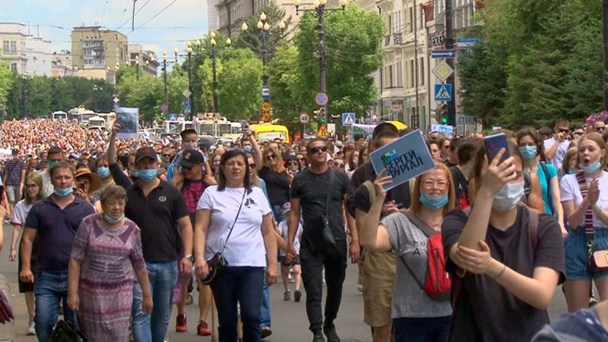 In this video grab taken from the Associated Press Television footage, people attend a protest in support of Sergei Furgal, the governor of the Khabarovsk region, who was arrested in Khabarovsk Thursday and flown to Moscow for interrogation, in Khabarovsk, Russia, Saturday, July 11, 2020. A court in Moscow ruled Friday to jail a provincial governor pending a probe on charges of his involvement in multiple murders. The arrest of Furgal, who has remained widely popular in his region, has stoked broad discontent, with a petition protesting his arrest quickly getting more than 37,000 signatures and residents of Khabarovsk staging pickets in his support.