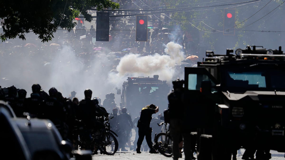 Smoke seen in photo as police clash with seattle protesters in 2020