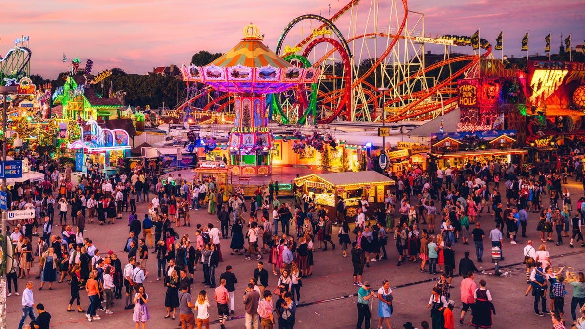 Visitors Walking Through Oktoberfest Fairgrounds, Munich, Germany