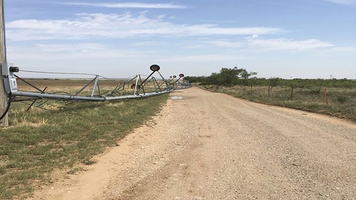 An irrigation system was also toppled by straight-line winds on Tuesday.