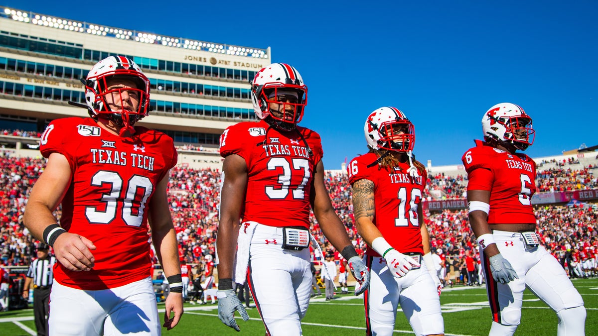 Texas Tech Red Raiders captains Jax Welch #30, Xavier Benson #37, Thomas Leggett #16 and Riko Jeffers #6 walk to the midfield coin toss before the college football game against the Iowa State Cyclones on October 19, 2019 at Jones AT&amp;T Stadium in Lubbock, Texas. (Photo by John E. Moore III/Getty Images)