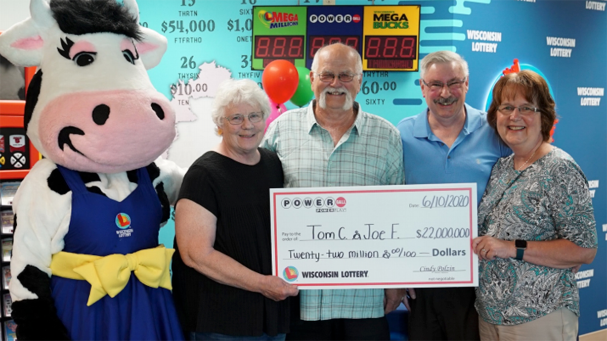 Tim Cook, Joe Feeney and their wives, collecting the prize-winning check