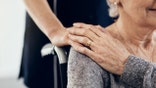 Cropped shot of a female caregiver comforting a senior woman