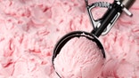 strawberry ice cream being scooped