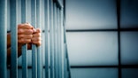 Prisoner in the jail cell