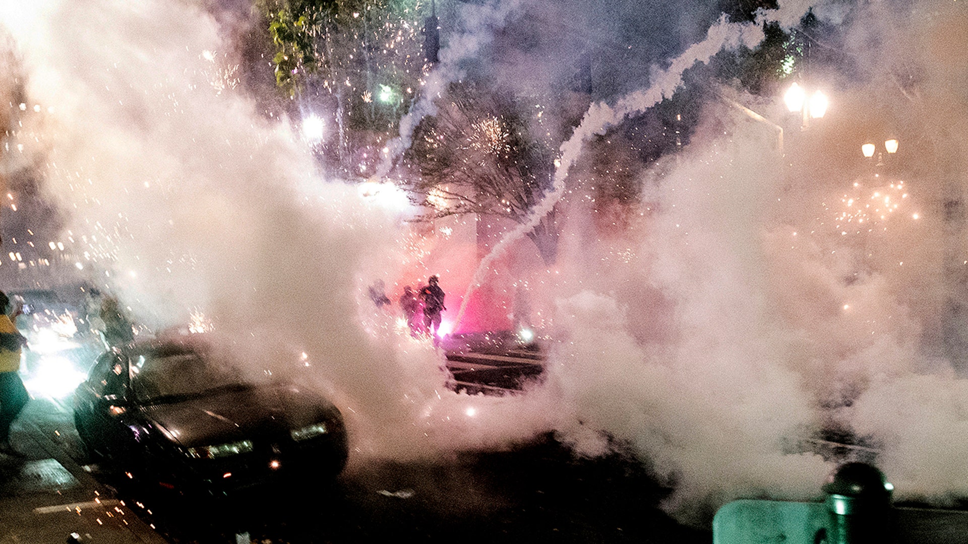 Smoke fills the sky as federal officers try to disperse Black Lives Matter protesters in Portland, Ore., July 22, 2020. 
