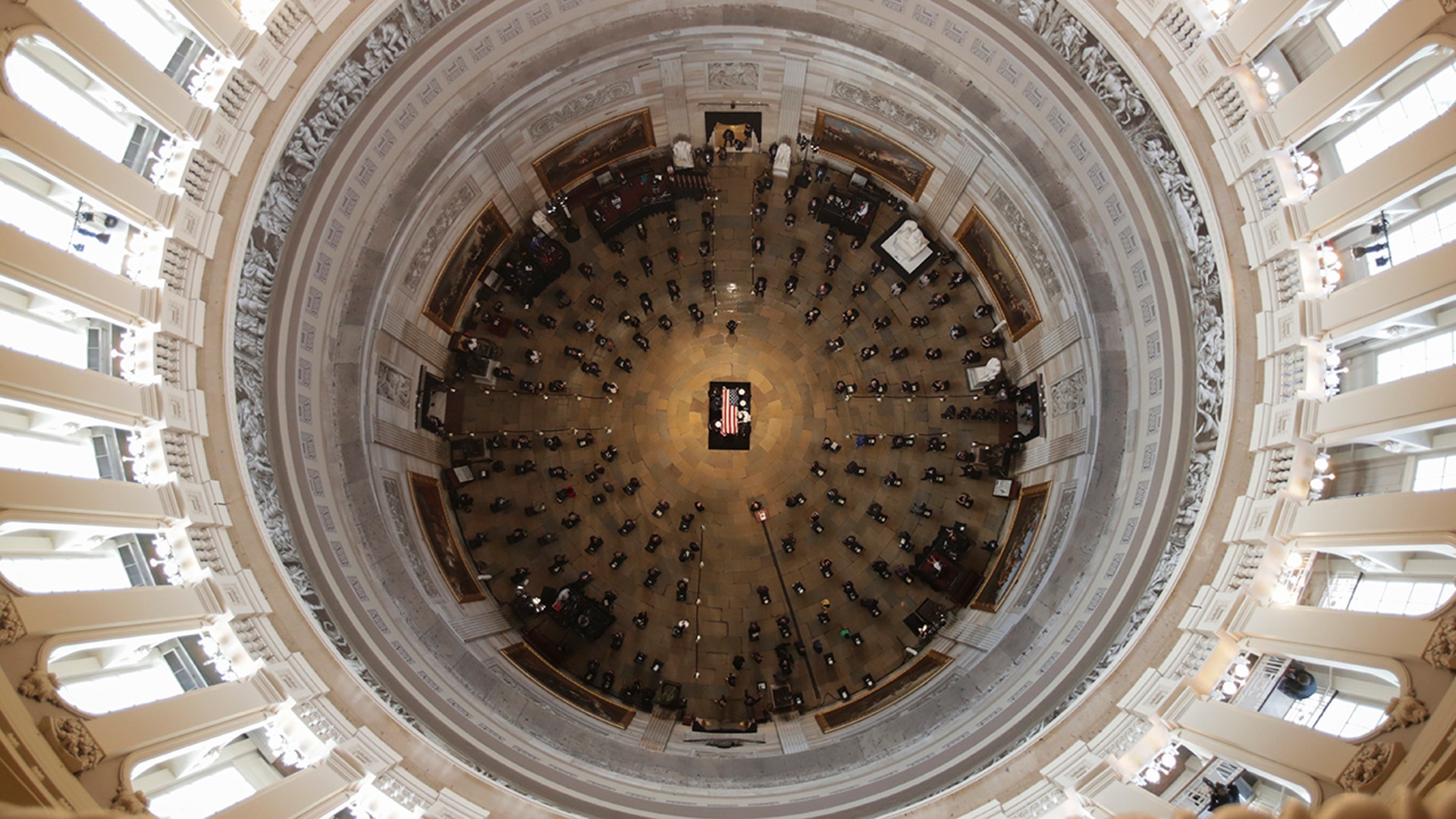 The flag-draped casket of civil rights pioneer Rep. John Lewis, D-Ga., who died July 17, is placed by a U.S. military honor guard at the center of the U.S. Capitol Rotunda to lie in state in Washington, D.C., July 27, 2020.