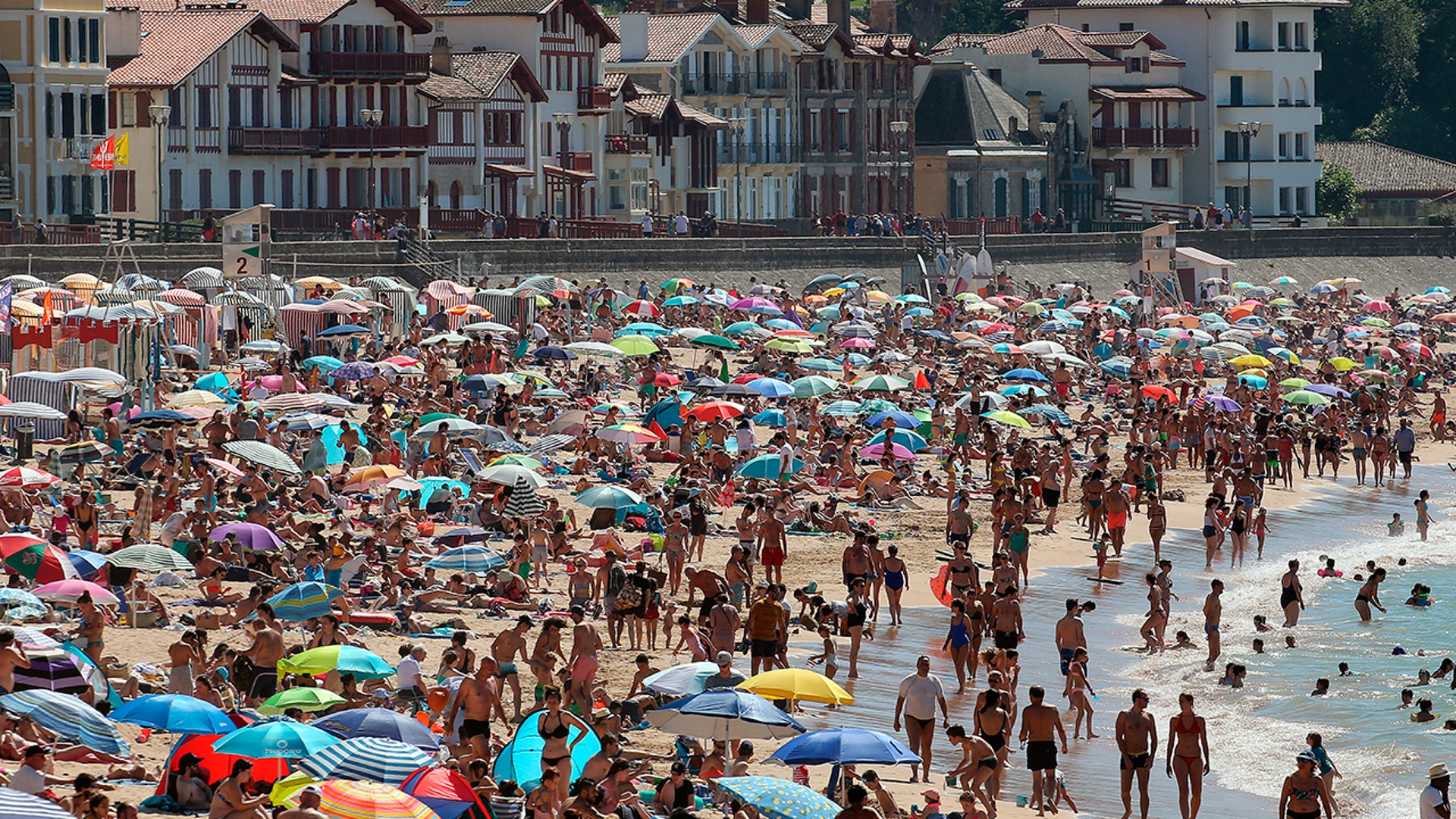 People sunbathe at Saint Jean de Luz' beach in southwestern France, July 18, 2020. 