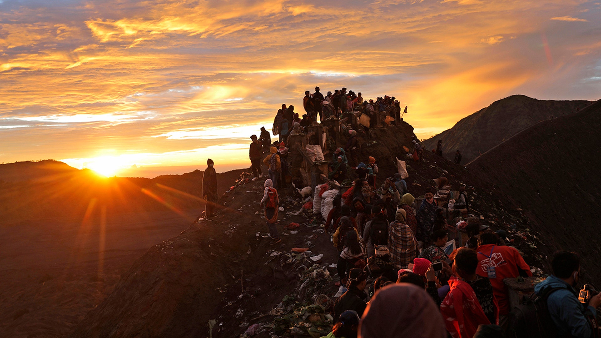 Hindu devotees and visitors make their way to the top of Mount Bromo at dawn during the Yadnya Kasada festival in Probolinggo, East Java, Indonesia, July 7, 2020. 