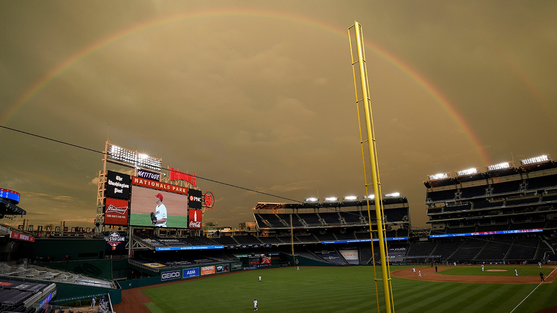A rainbow is seen over Nationals Park during a game between the Washington Nationals and Toronto Blue Jays in Washington, July 28, 2020.