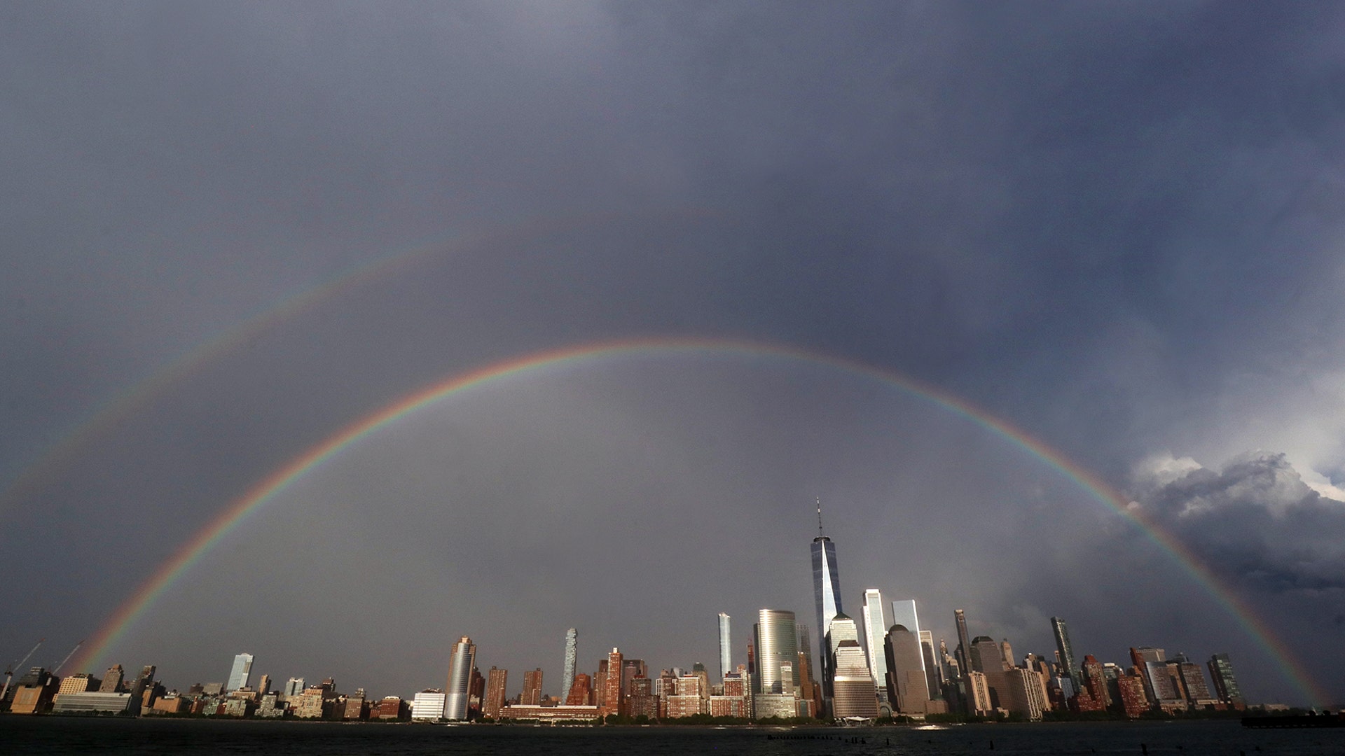 A double rainbow forms in the sky over lower Manhattan and One World Trade Center during weekend Pride celebrations in New York City, June 28, 2020 