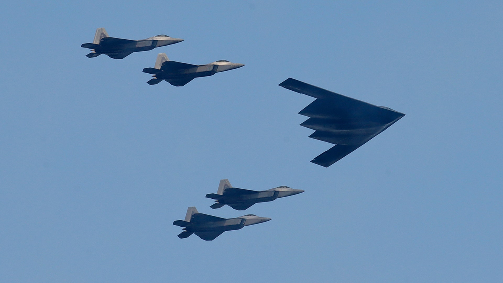 A B2 bomber leads a group of fighter jets in a flyover as part of Independence Day festivities in New York City, July 4, 2020.