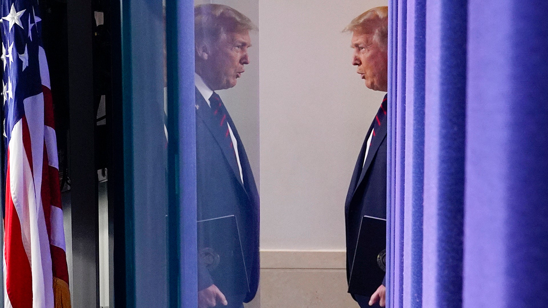 President Donald Trump arrives for a news conference at the White House in Washington, July 21, 2020. 