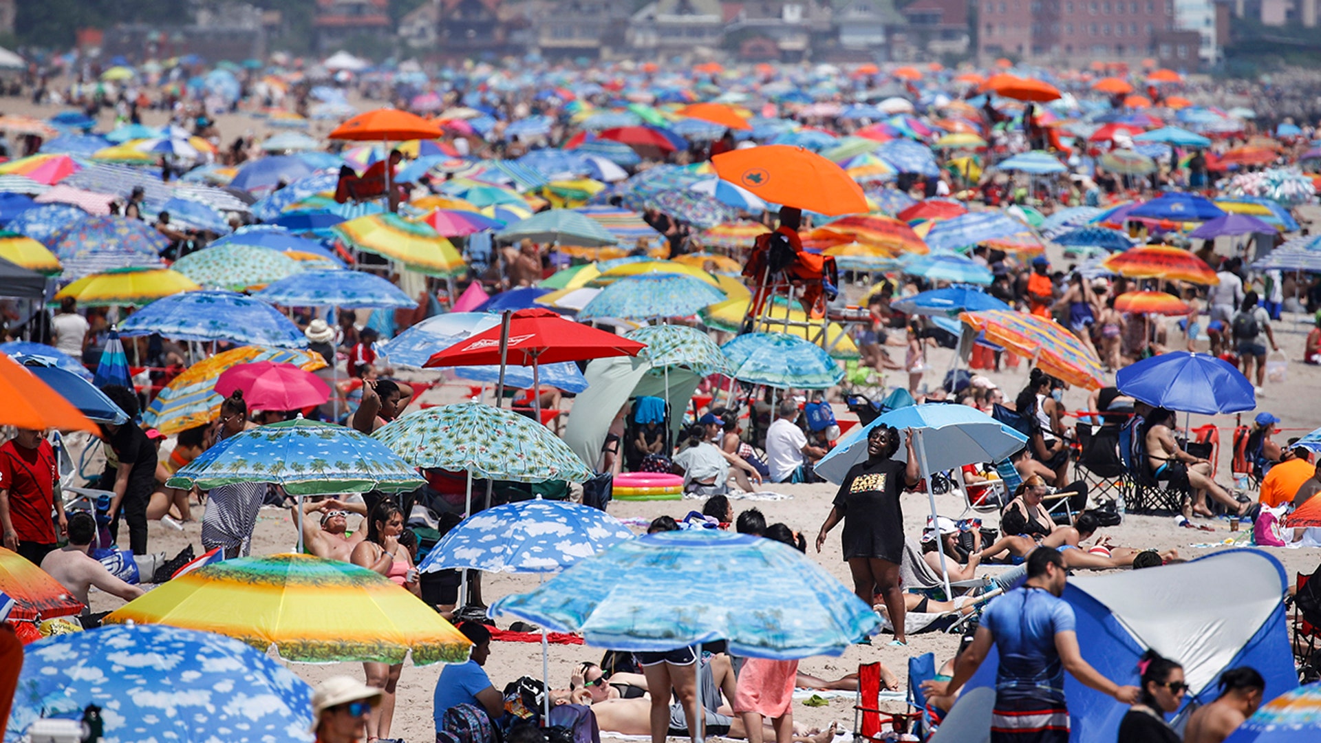 Revelers enjoy the beach at Coney Island in New York City, July 4, 2020.