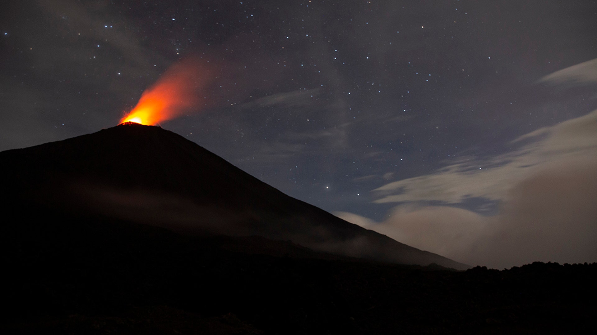 Pacaya volcano spews lava, viewed from San Vicente Pacaya, Guatemala, July 25, 2020.