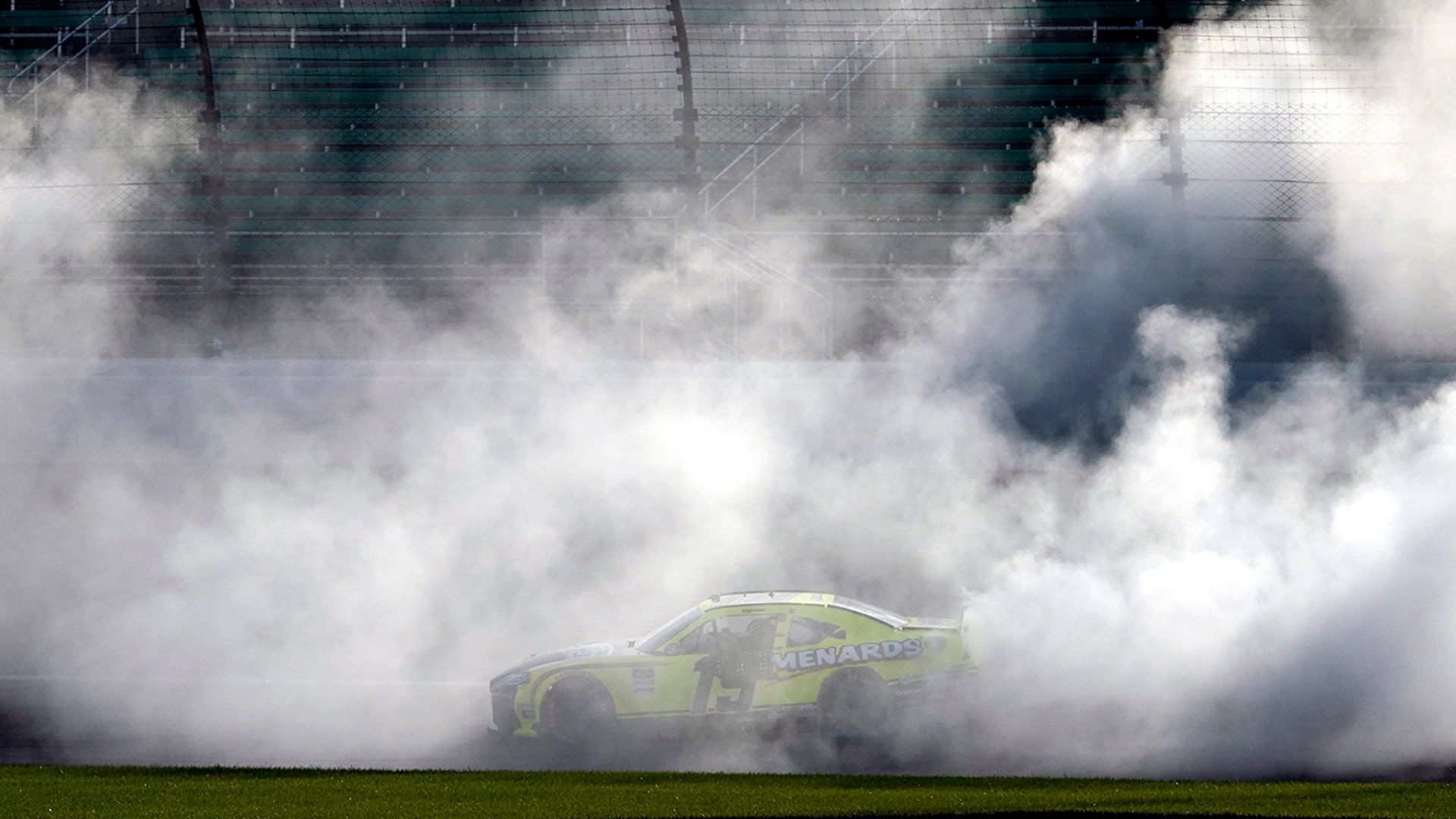 Brandon Jones does a burnout after winning a NASCAR Xfinity Series auto race in Kansas City, Kansas, July 25, 2020.