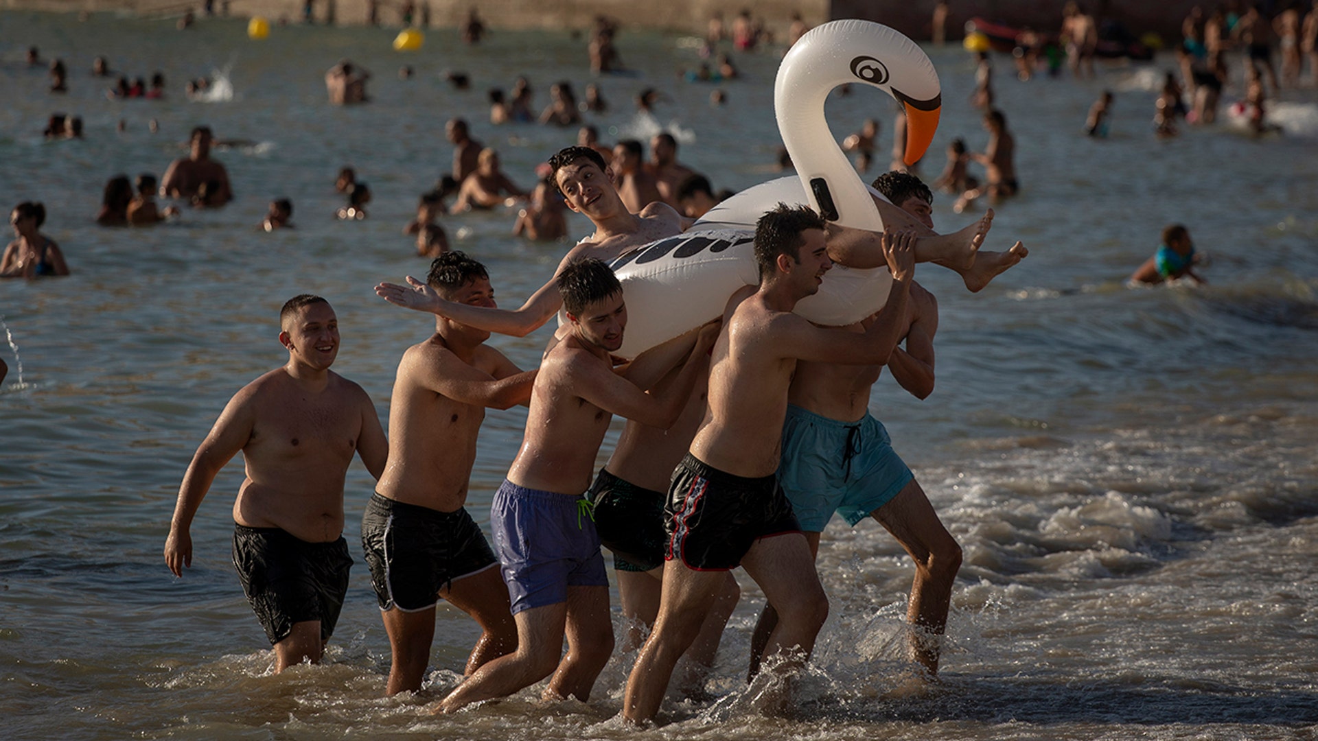 Bathers enjoy the beach in Cadiz, Spain, July 24, 2020.