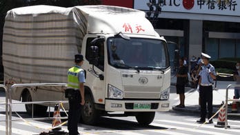 Moving trucks with diplomatic plates spotted leaving US consulate in China as police clear pedestrians